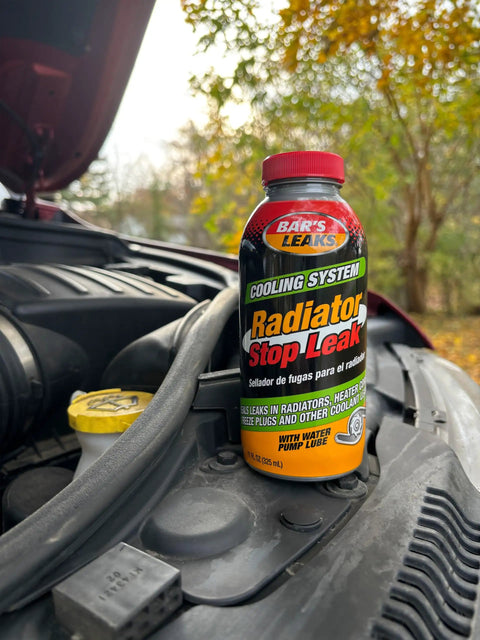 Radiator Stop Leak 11 Oz Quick Fix No Fuss For Cars Seals Internal External And Coolant To Oil Leaks With Pelletized Formula bottle on car engine