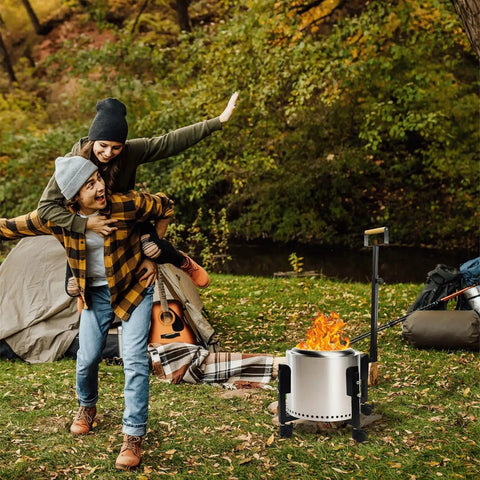 Rolling Stand With Telescopic Handle For Ranger 15.5 Inch Smokeless Fire Pits A 17.5 Inch Portable Base On Wheels in forest setting