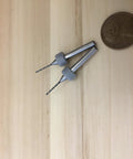 Two Pack.9mm Micro Drill Bits For 3D Printer Nozzle Cleaning And PCB Maintenance next to a penny for size comparison