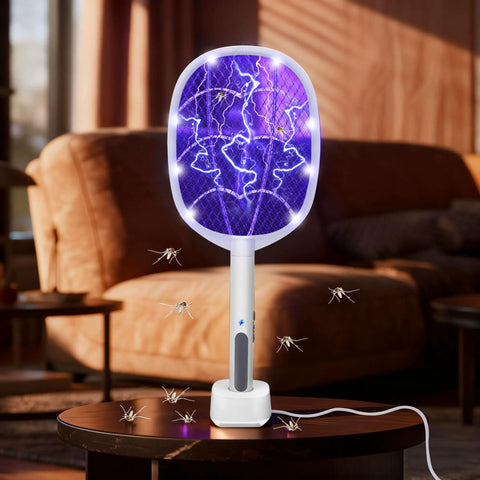 3 Pack Electric Fly Swatter Rackets For Home And Outdoor Use. High voltage bug zapper on table, ideal for mosquito control.