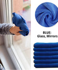 EvaClean blue microfiber cleaning cloths; hand wiping glass, close-up of fabric texture, stack of five towels