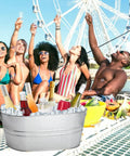 Two Pack Four Gallon Galvanized Ice Buckets With Handles For Parties Portable Beverage Tub filled with bottles and ice at a party
