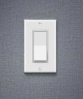 White 20 Pack Single Pole Decorator Light Switch With Wall Plate 15A 120 277V AC Rocker Paddle Interrupter mounted on gray wall