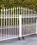 8 Inch Gate Wheel Heavy Duty Gate Caster For Farm And Metal Swing Gates Fits One And Three Eighths To Two Inch Gate Frames Prevents Gate Drag On Chain Link And Sliding Gates With 330 Lb Capacity And Durable Rubber Tire On Steel Plate With Galvanized installed on white metal gate