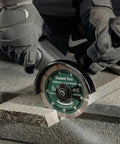 Job Ready 4.5 Inch Diamond Blades For Angle Grinders 2 Pack Featuring Heavy Duty Segmented Turbos For Crisp Concrete Stone Brick And Granite Cuts Dry Wet Operation in use cutting concrete.