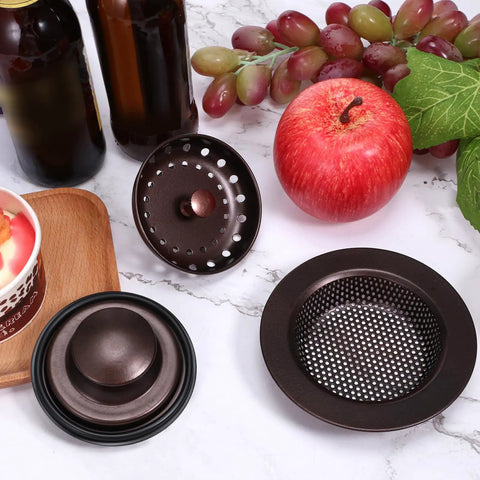 Three Piece Kitchen Sink Drain Strainer And Stopper Set Stainless Steel Garbage Disposal Plug With Handle Universal Fit Anti Clogging Filter Sieve Basket For Most 3 Point 5 Inch Drains Oil Rubbed Bronze displayed with fruits on countertop