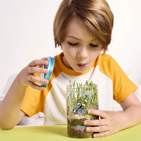 Child exploring Grow N Glow Terrarium Kit For Kids, Educational Science Kit For STEM Projects, Spring Crafts, and Hands On Learning