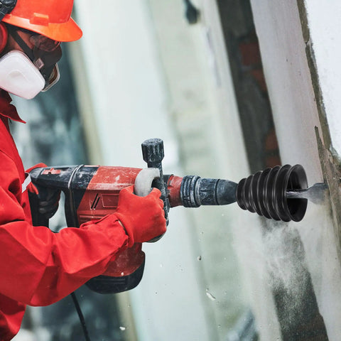 5 Pack Top Shelf Heavy Duty Silicone Drill Dust Collectors For Electric Hammer And Impact Drills Black in action with dust collection.