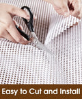 Top Shelf Nonslip Shelf Liner For Kitchen Cabinets And Drawers, White Non Adhesive Mat being cut with scissors for easy installation.