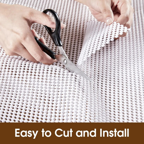 Top Shelf Nonslip Shelf Liner For Kitchen Cabinets And Drawers, White Non Adhesive Mat being cut with scissors for easy installation.