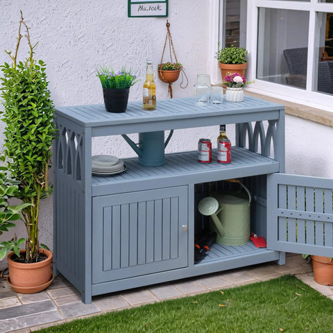 All in One Acacia Wood Outdoor Storage Cabinet With Two Magnetic Doors Weatherproof shown on a patio with plants and decor