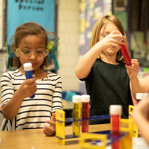 Kids using Large Plastic Test Tubes and Rack Set With Six Bottles Kid Friendly Science Experiments Durable Clear Lab Kit for STEM learning