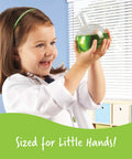 Child holding a flask with green liquid from Primary Science Deluxe Lab Kit For Kids 45 Piece Preschool STEM Toys Set.