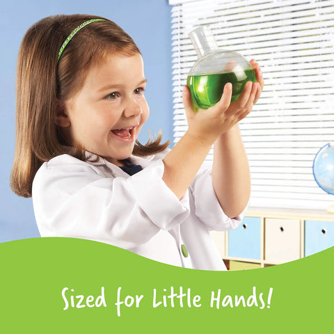 Child holding a flask with green liquid from Primary Science Deluxe Lab Kit For Kids 45 Piece Preschool STEM Toys Set.