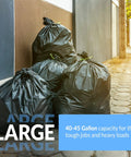 40 To 45 Gallon Heavy Duty Trash Bags 50 Pack Black Garbage Bags For Serious Cleanup displayed outside a building