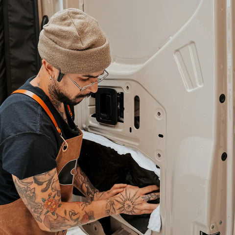 Hella Slick Camper Van Insulation Panels Deliver Top Tier Thermal Soundproofing Wrap For Custom Builds featuring installation process on van door.