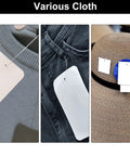 Various clothing items with white tags using Top Shelf Heavy Duty Plastic Tagging Fasteners For Clothes And Retail 3 Inch Black Label Gun Barbs.