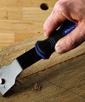 Durable Glue And Wood Scraper With Ergonomic Rubberized Handle And Reversible Blade For Furniture Refinishing Pro Grade Compact Lightweight Tool In Use On Wood Surface