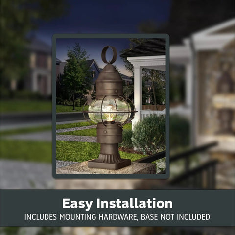 Outdoor Lantern Post Light With Rustic Bronze Finish on lawn, classic scroll arm, seedy glass shade, evening setting