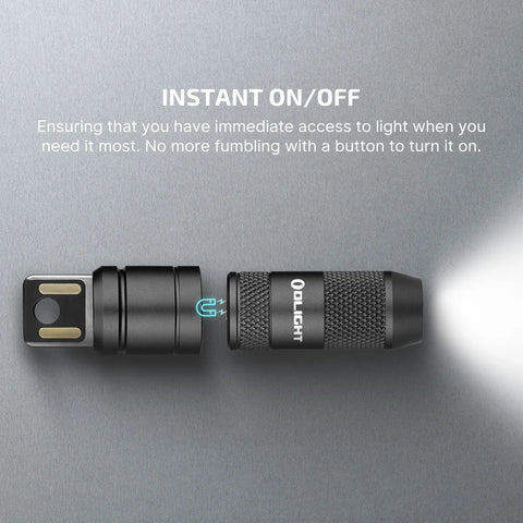 Imini 2 EDC Rechargeable Keychain Flashlight With 50 Lumens Output showing magnetic cap and LED light emitting beam