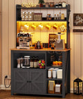 35.4 Inch Coffee Bar Cabinet With Power Outlet And Storage, Boss Level Farmhouse Microwave Stand With Hutch, LED Lights, Wine Glass Holder And 8 Hooks, Black Kitchen Organizer For Countertop And Pantry displaying coffee accessories and storage.