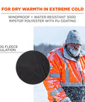 Man wearing Hi Vis Reflective Winter Bomber Jacket With Zip Out Fleece Liner in snowy landscape, showing ANSI Compliant ripstop shell.