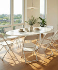 Folding Chairs Set Of 20 With 330 Lb Capacity around a dining table in a bright indoor setting