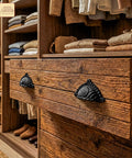 Matte Black Cup Drawer Pulls For Cabinets And Kitchen, Mystic Colonial Style on wooden dresser, 3.7x2.1 cast iron