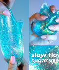 Blue Gelli Gel Squishy Boasting Slow Flow Glitter And Iconic Shape Memory For Ultimate Stress Relief And Seriously Dope Fidget Fun That Hits Different Every Time You Play in hand.