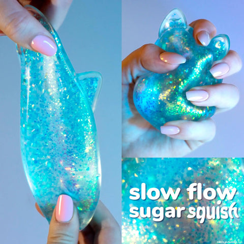 Blue Gelli Gel Squishy Boasting Slow Flow Glitter And Iconic Shape Memory For Ultimate Stress Relief And Seriously Dope Fidget Fun That Hits Different Every Time You Play in hand.