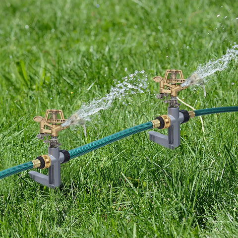 Dual impact sprinkler head on metal step spike, heavy-duty zinc alloy, watering lawn with adjustable 360 to partial circle irrigation.