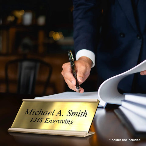 Custom Engraved Brushed Brass Office Door Name Plate And Personalized Desk Sign Featuring Sleek Metal Construction Easy Cubicle Wall Or Adhesive Mount For Bosses Crushing It Daily on a desk.