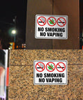 Straight Up Heavy Duty No Smoking And No Vaping Sign 2 Pack Reflective Metal Warning Plaque 10 By 7 Inches mounted on a wall.
