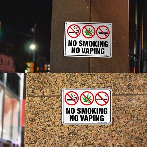 Straight Up Heavy Duty No Smoking And No Vaping Sign 2 Pack Reflective Metal Warning Plaque 10 By 7 Inches mounted on a wall.