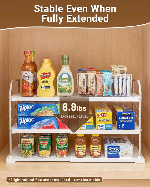Heavy Duty Expandable Three Tier Kitchen Cabinet Organizer And Pantry Shelf Rack for food storage, fully extended with various items.