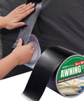 Person applying Waterproof Self Adhesive Patch Repair Tape Kit For Awnings Outdoor Canopies Tents RVs Canvas And Boat Covers.