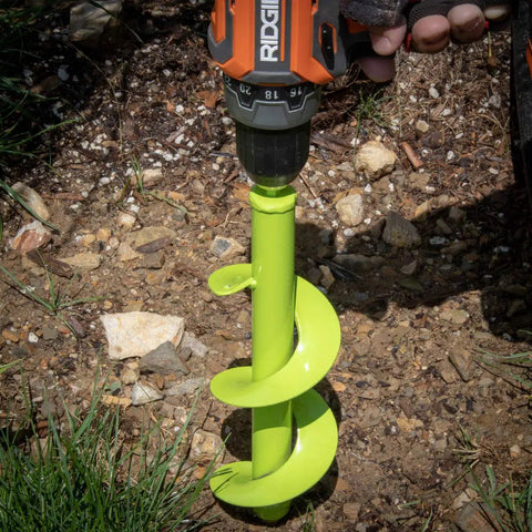 Rapid Planting Bulb Auger Drill Bit 3.5 X 12 Inches for Post or Umbrella Hole Digger, lime green tool in soil, side view