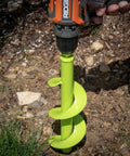 Auger Drill Bit For Planting Bulbs And Flowers Digs Holes Fast in soil attached to a drill, 3.5 x 8.5 inch size, bright green color