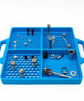 Silicone Fastener Tray For Bolts, Nuts, And Bits With Handy Handle holding various fasteners on white background