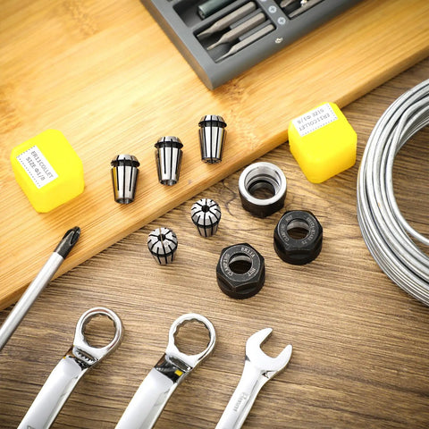 9 Pcs ER11 Spring Collet Nut Set with 1/8 inch and 1/4 inch collets and clamping nuts displayed on a wooden surface