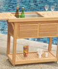 Solvang Teak Bar Cart With Extendable Beverage Tub And Locking Wheels For Outdoor Patio Entertaining next to pool