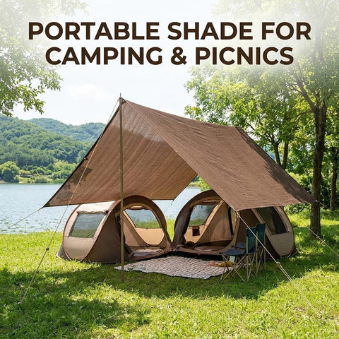 Mocha Shade Cloth With Ninety Percent UV Block Mesh Tarp set up over camping area by lake with tents