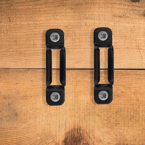 Heavy Duty Black Furniture Connectors And Hidden Screws For Dressers Bookshelves 50 Set on wooden background.