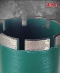 Close-up of Archer PRO 2-1/4in diamond core drill bit for concrete drilling, segmented turbo edge, green body.