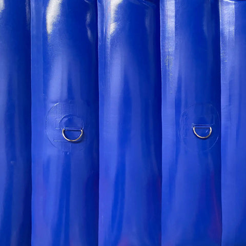 Close-up of heavy duty inflatable sound blocker for construction yards with secure metal rings for anchoring.