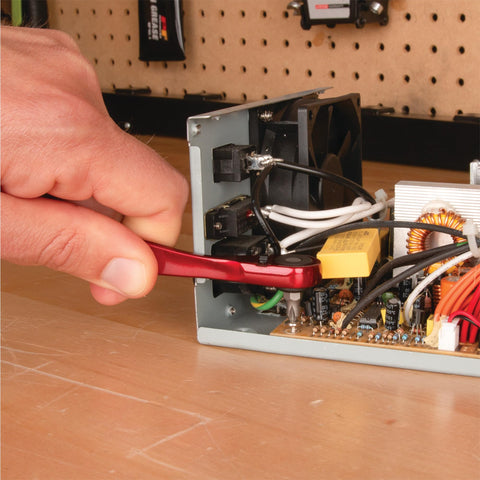 Using Quarter Inch Drive Anodized Stainless Steel Ratchet With 72 Tooth Gear to adjust screws inside electronic device.