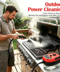 Man cleaning BBQ grill with Beast 2500W Handheld Steam Cleaner With Pressurized 105C Steam, 10 In 1 Multi Purpose Cleaner.
