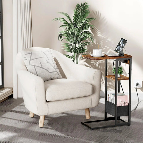 C Shaped End Table With Charging Station For Sofa And Living Room beside a white armchair, showcasing 3 layer storage and USB port.