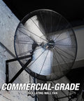 Beastly 30 Inch Indoor Oscillating Wall Fan With 9500 CFM Max mounted on a industrial wall with 90 degree angle