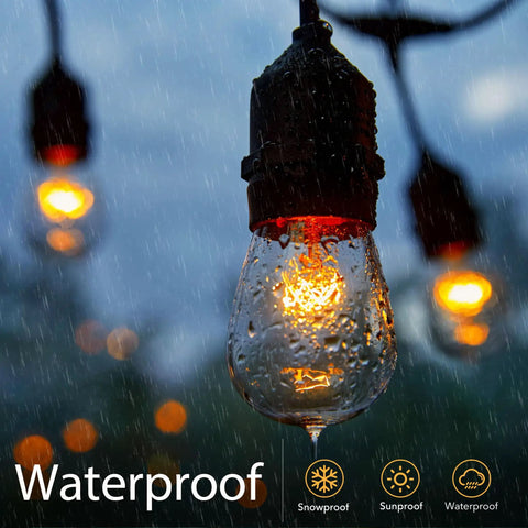 Close-up of lit 26 Pack S14 Light Bulbs for Outdoor String Lights with 11 Watt E26 Medium Base Clear Glass in rain